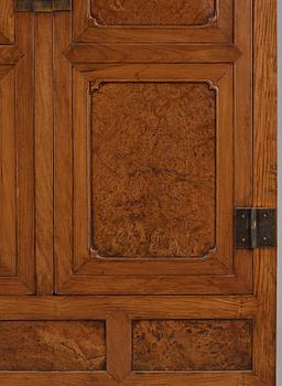 A huanghuali veneered, huamu and mixed wood cabinet, 19th century, Qing dynasty, 19th Century.