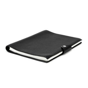 244. HERMÈS, a black leather notebook, "Moyen Modèle".