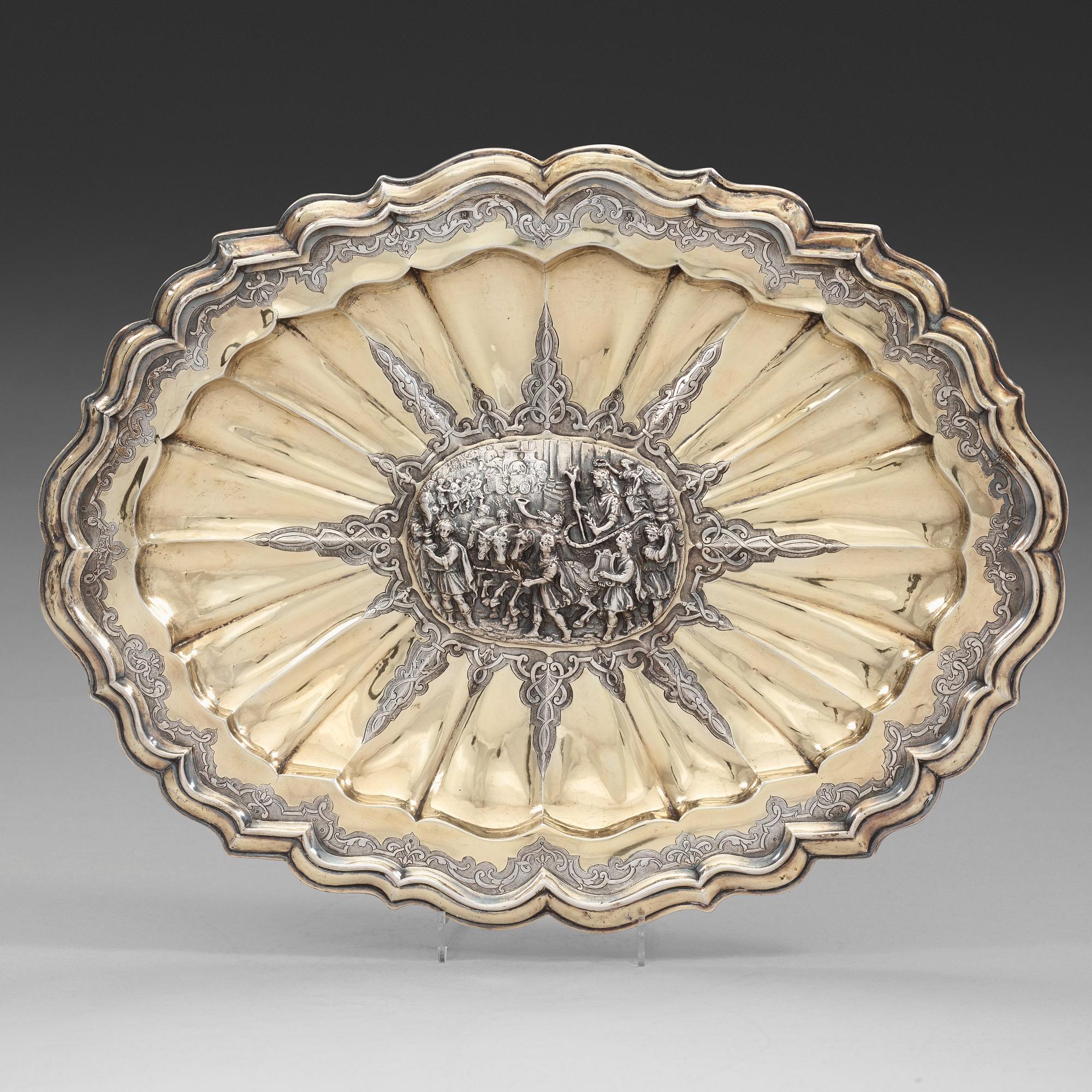 A German 18th century parcel-gilt dish, mark of Johann Gemeinhart, Nürnberg (1727-1739).