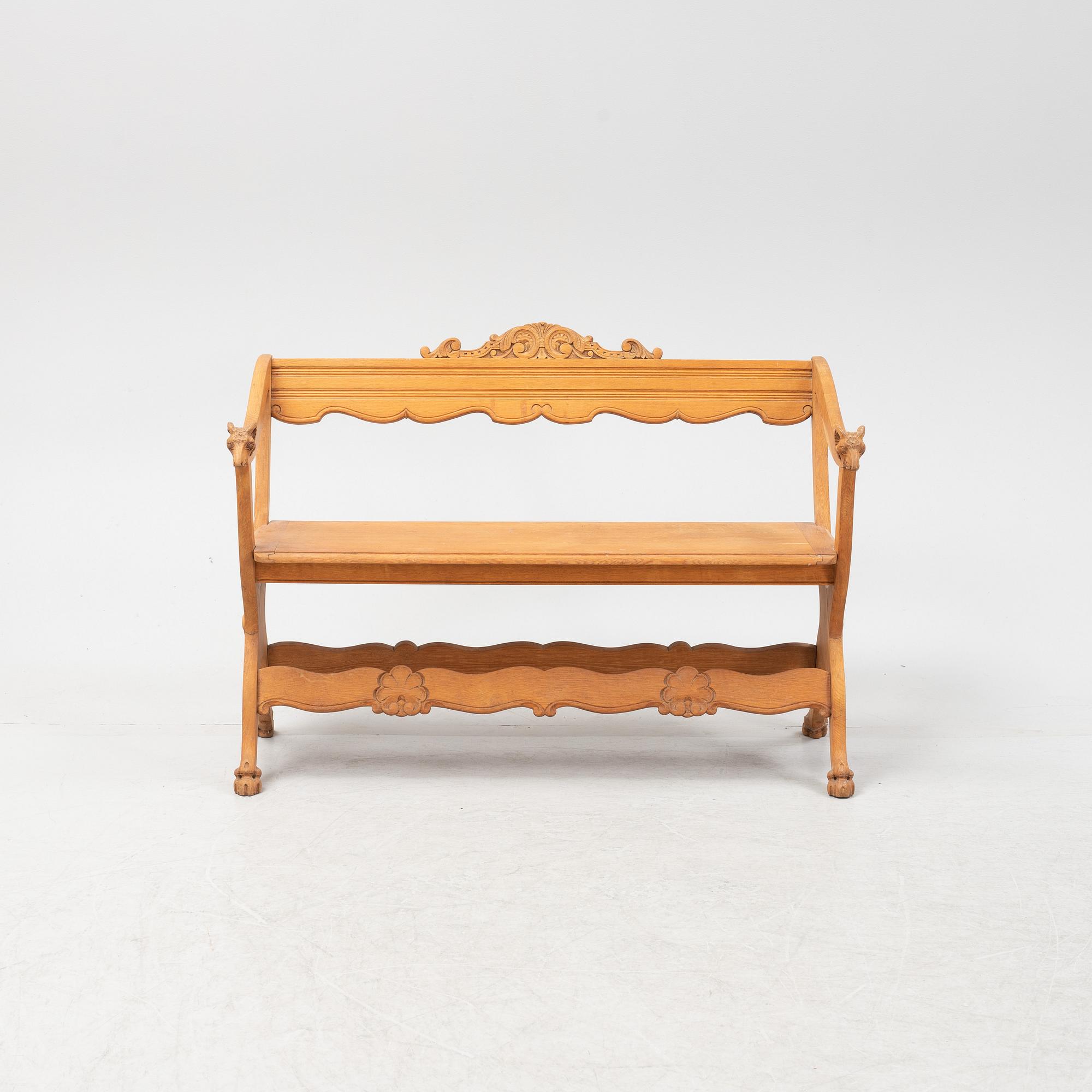 A carved oak sofa, circa 1900.