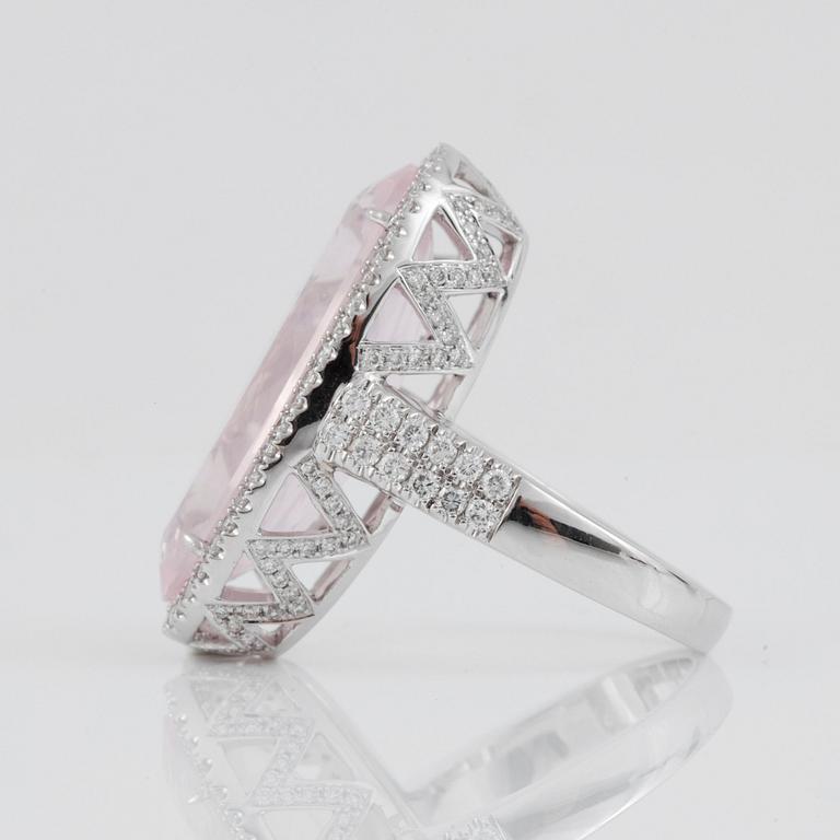 A rose quartz, circa 12.00 ct, and brilliant-cut diamond, circa 1.12 ct, ring.