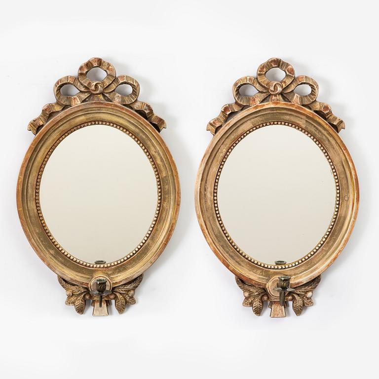 A pair of Gustavian one-light girandole mirrors, 20th century.