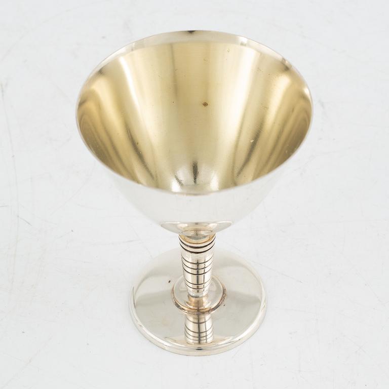 Folke Arström, eight silver plate cocktail glasses and a shaker, GAB.