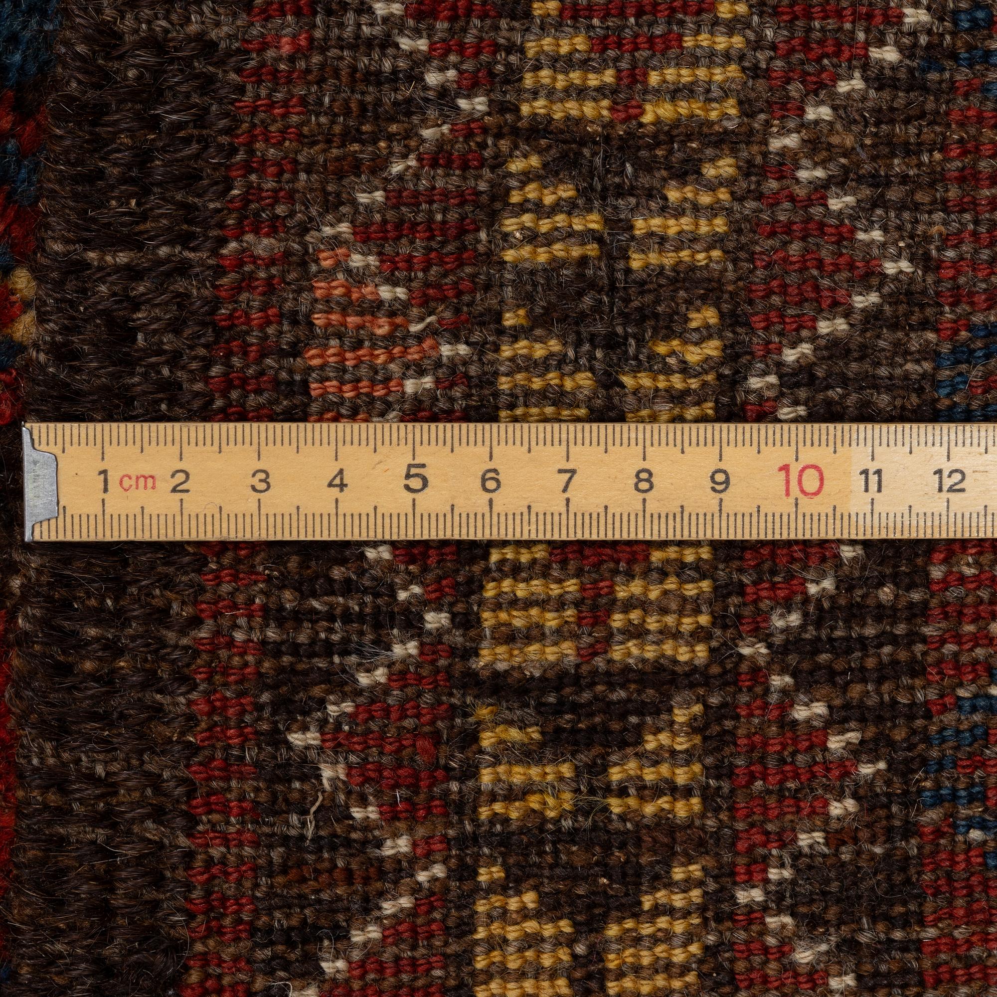 An antique Beshir carpet, ca 495 x 206 cm, around the year 1875.