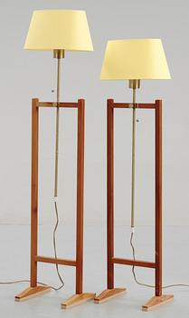 A pair of Josef Frank walnut and brass floor lamp by Svenskt Tenn, model 2548.
