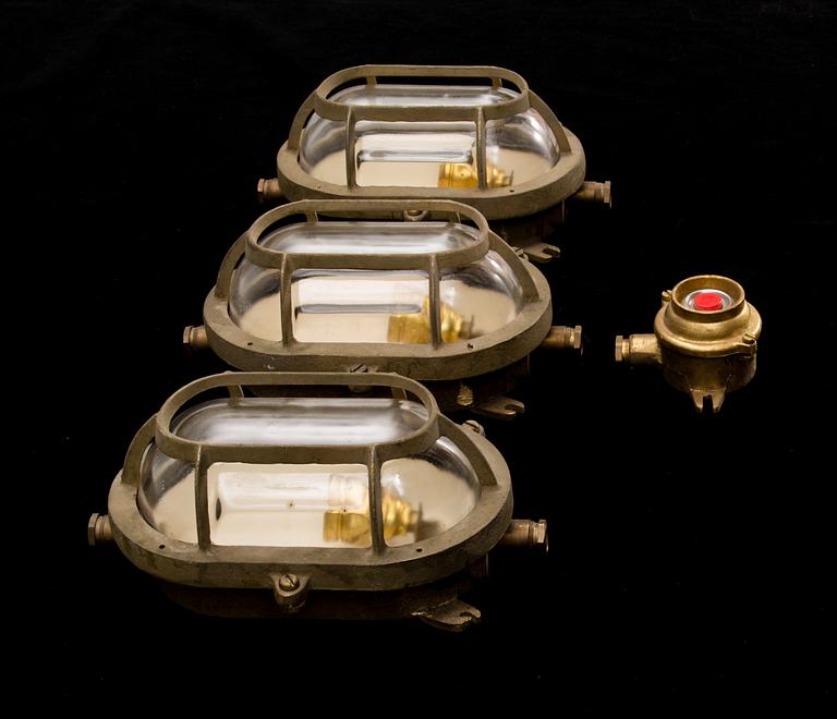 A set of three lights and a switcher from the latter half of the 20th century.