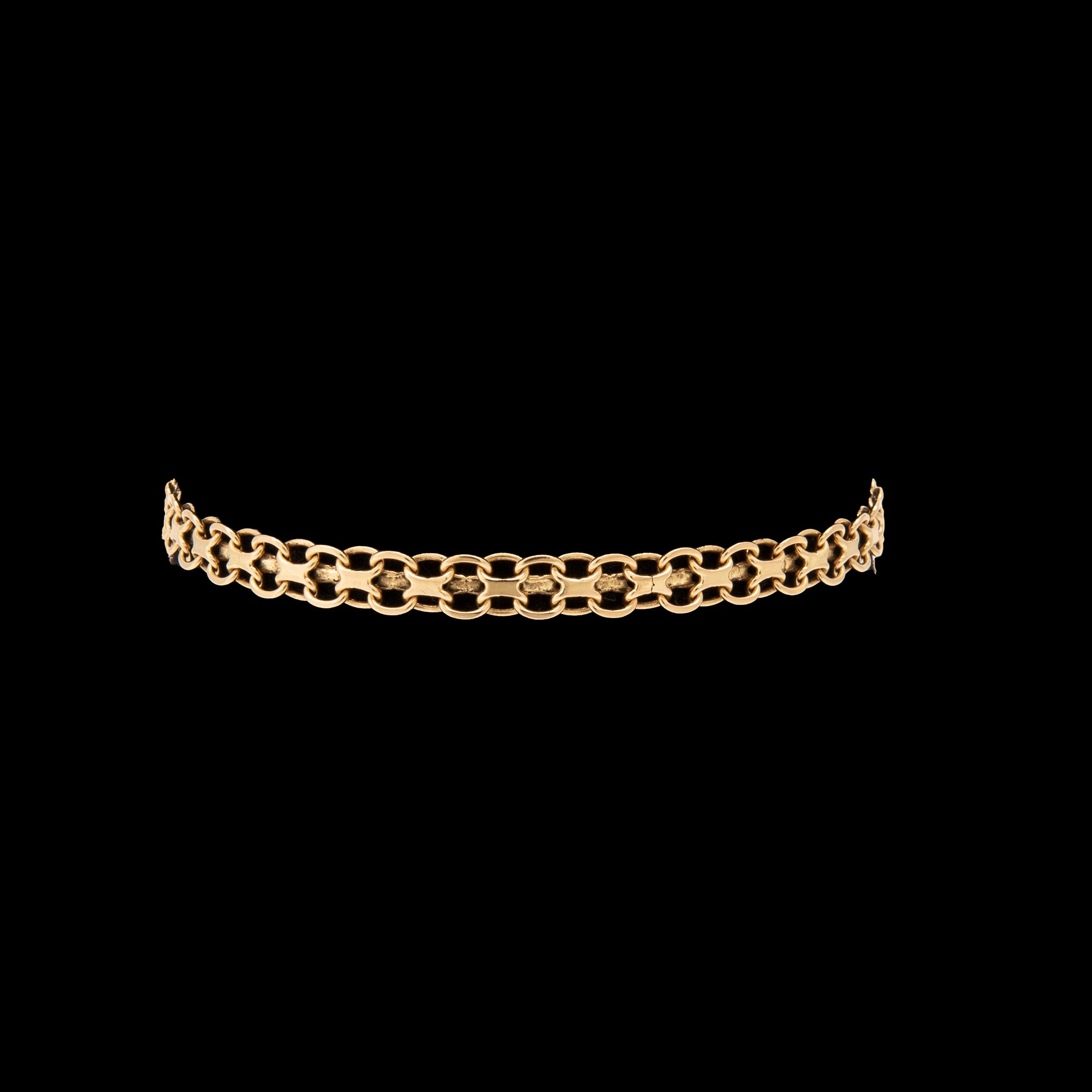 An 18K gold x-link bracelet.