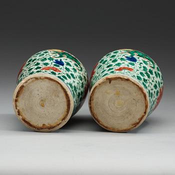 A pair of Transitional Wucai jars, 17th Century.