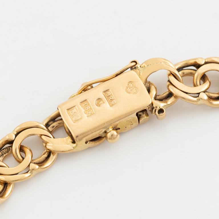 Bracelet 18K gold, bismarck, with two pendants 14K gold.