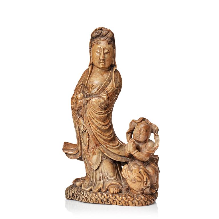 A soapstone sculpture of Guanyin with an attendant, Qing dynasty.