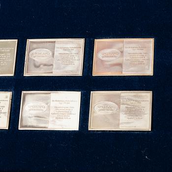 Plaketter, 12 st, silver, "De Historiska Volvobilarna 1927-1977", Franklin Mint.