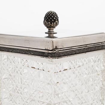 K. Fabergé, a pair of cut-glass toilette boxes in silver stand, Imperial Warrant mark, Moscow 1896.