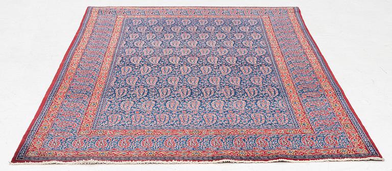 A semi-antique Qum rug, approx. 212 x 139 cm.