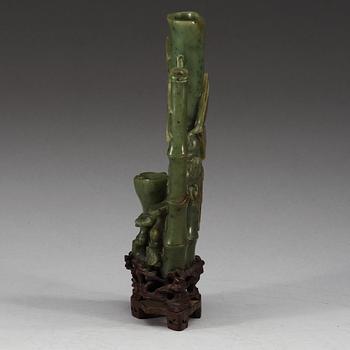 A  carved green stone sculpture, late Qing dynasty.
