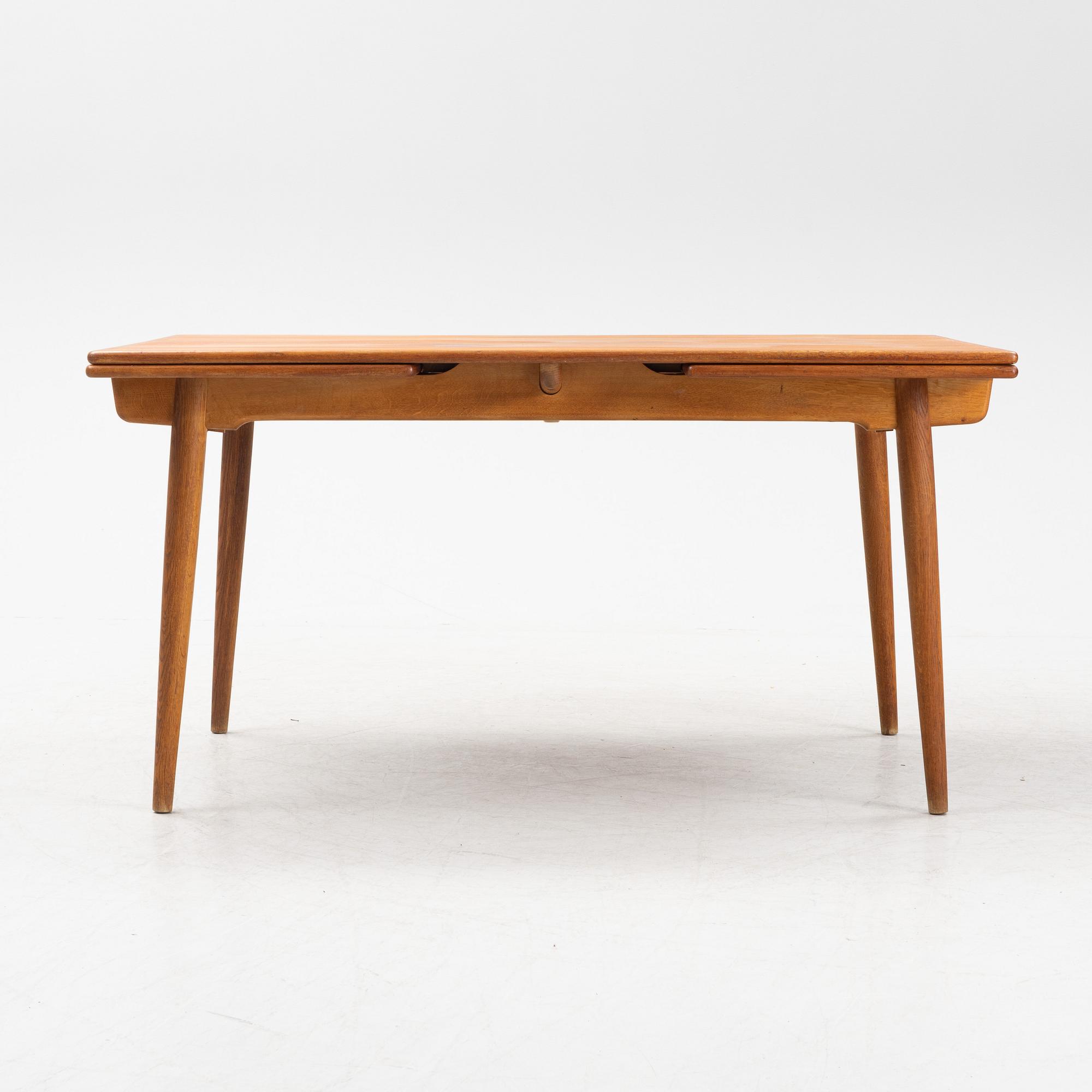 Hans J Wegner, a model 'AT-312' teak veneered dining table, Andreas Tuck, Denmark.