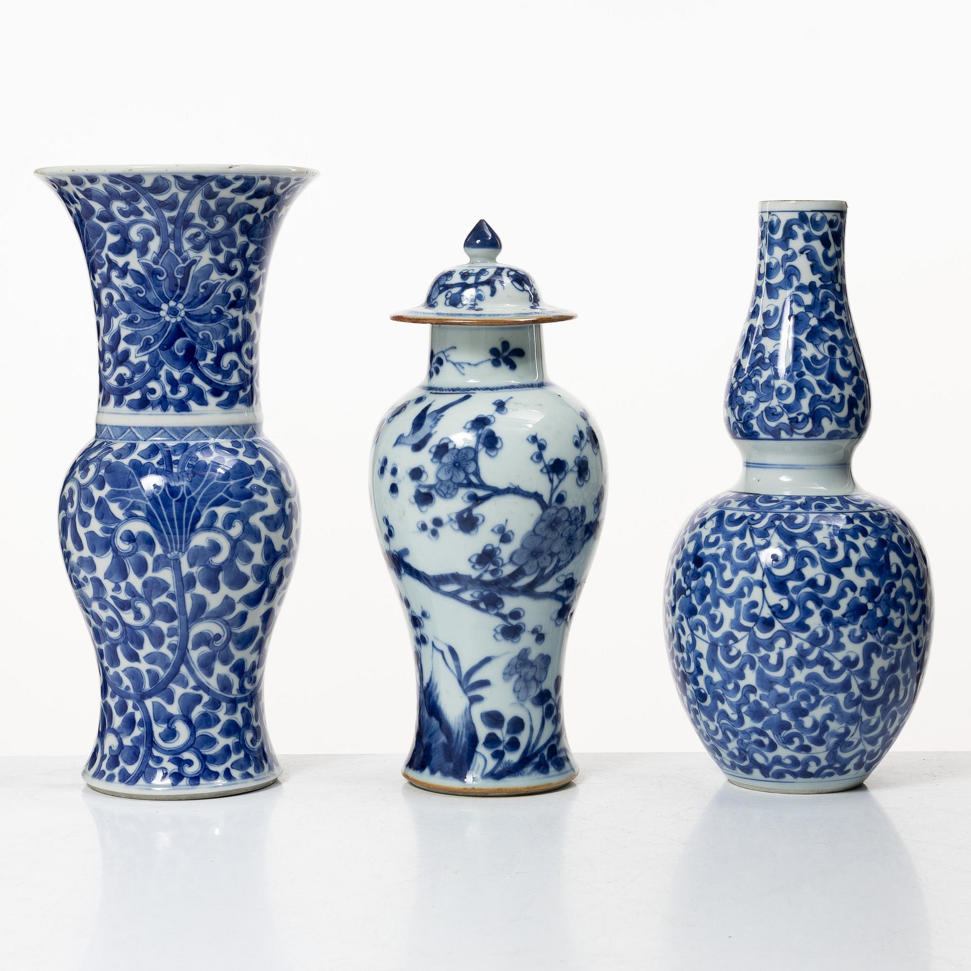 Two blue and white vases, Qing dynasty, 19th century and a blue and white vase with cover, 18th century.