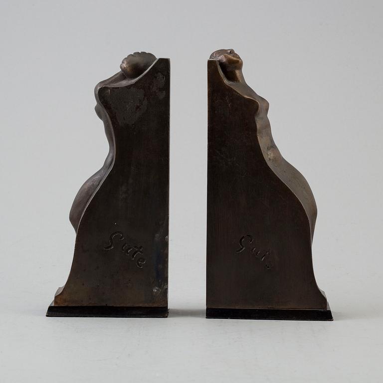 A pair of circa 1920 bronze book ends by Axel Gute, signed.