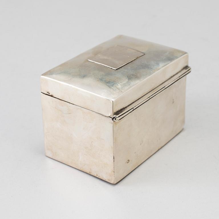 A silver calculator by Tiffany's and cuff link box in silver H.V.P & Co Birmingham 1887.