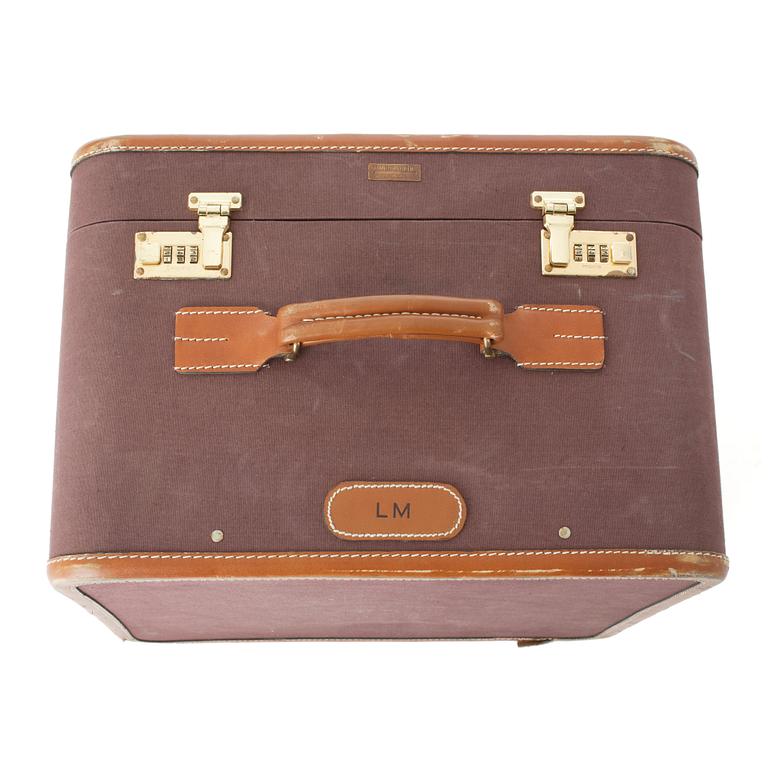 T ANTHONY Ltd, a aubergine canvas shoe suitcase from the 1970s.