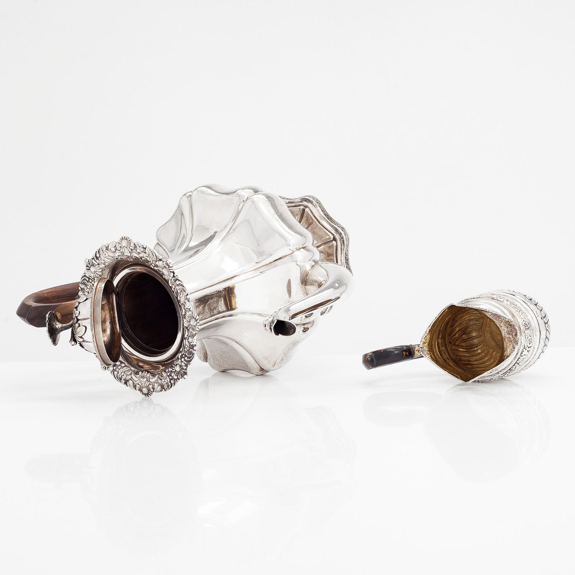 A silver coffee pot, and silver cream jug, Olof Robert Lundgren, Turku 1847 and Fredrik Strömsten, Helsinki 1839.
