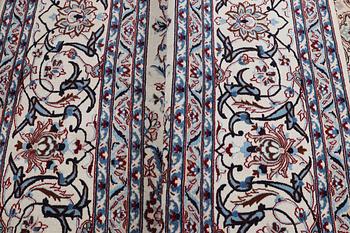 A carpet, Nain, part silk, ca 426 x 309 cm.