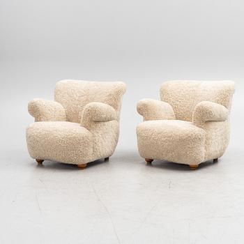 A pair of Swedish Modern armchairs, mid-20th Century.