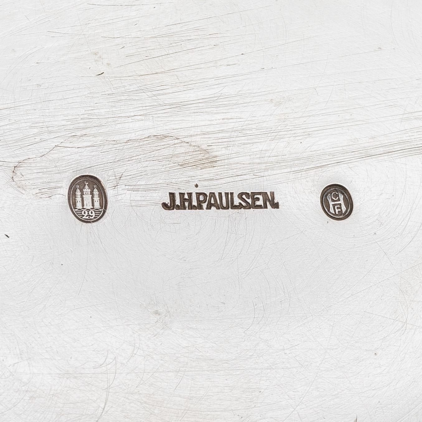 A Danish silver jug and three salt cellars, first half of the 10th Century.