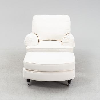 An easy chair with ottoman from Englesson, 21st century.