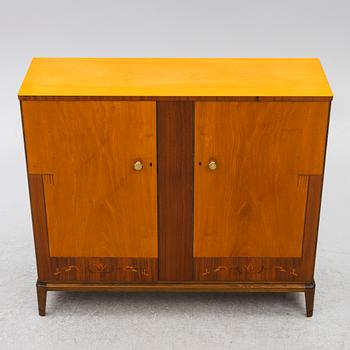 A Swedish Modern cabinet, mid20th century.