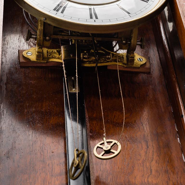 A Lenzkirch walnut wall clock from Germany, 1910s / 20s.