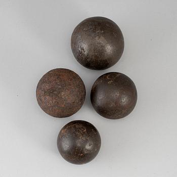 Four19th century iron bullets.