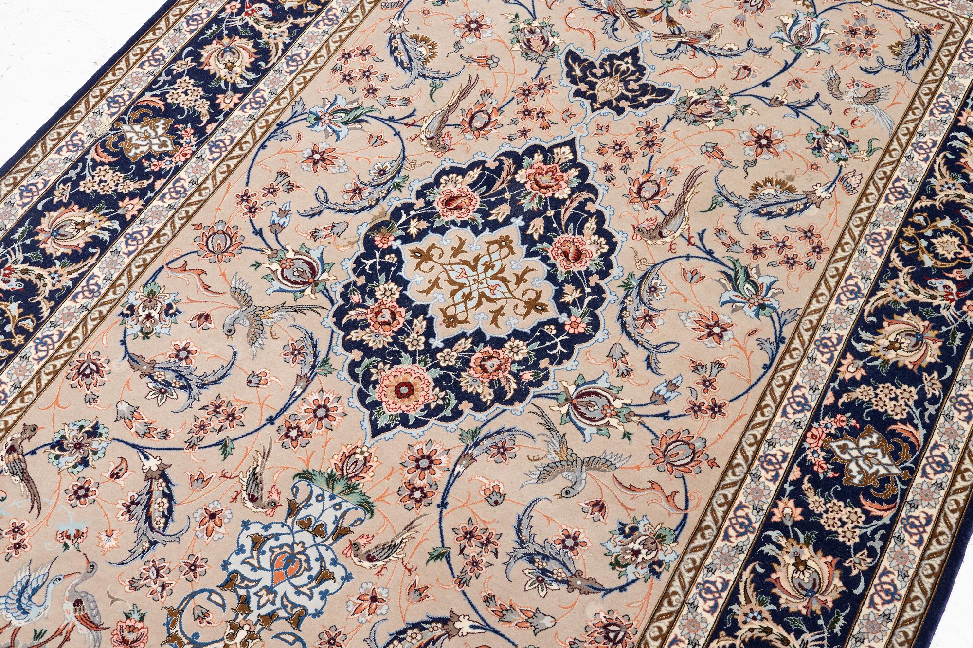 An Isfahan rug, c. 220 x 145 cm.