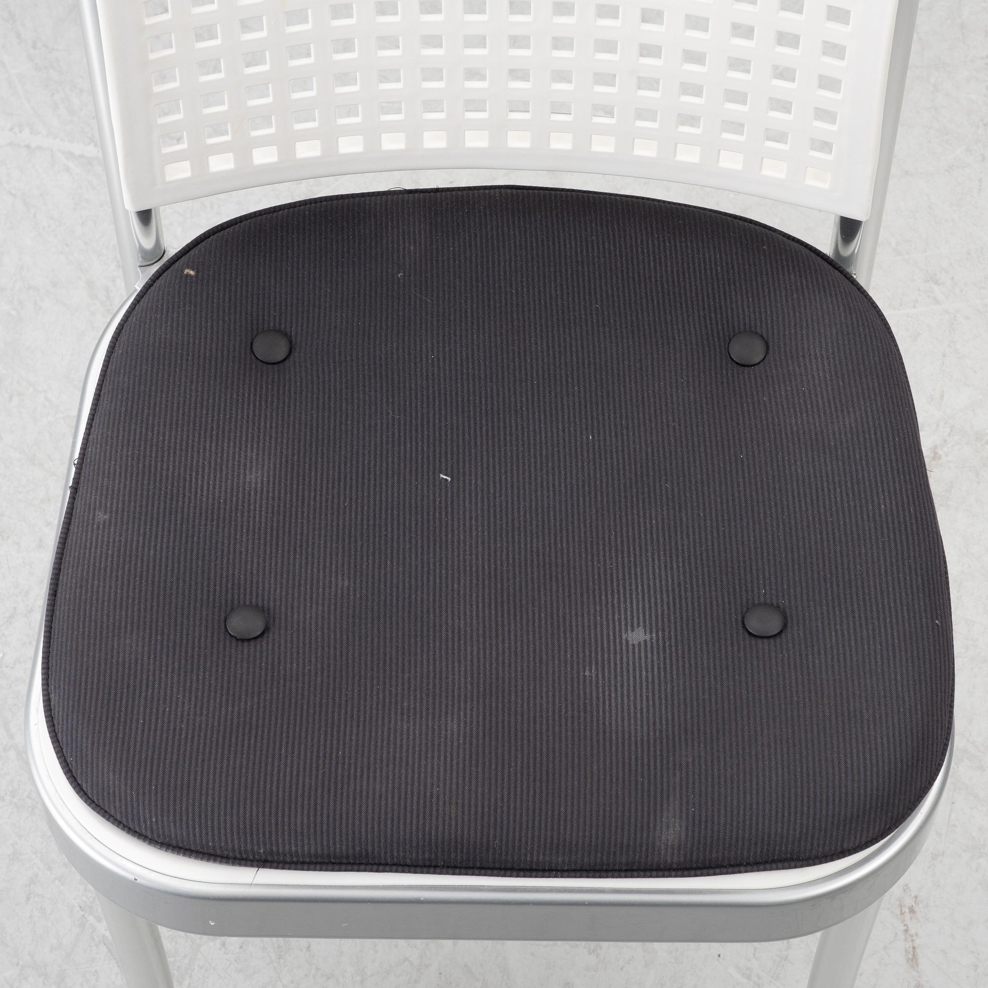 Vico Magistretti, a "Shine" dining table with twelve chairs, De Padova, Italy, around the year 2000.