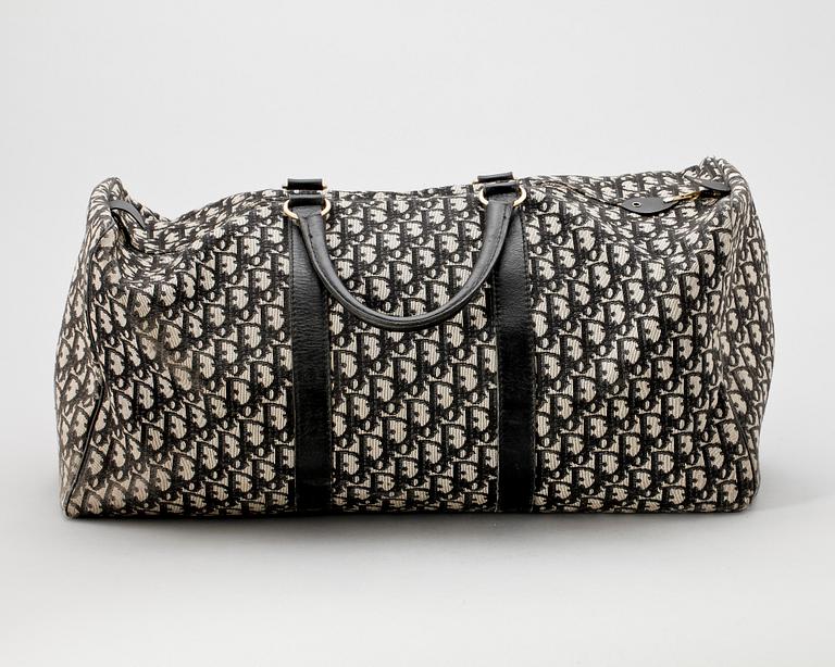 A black monogram canvas weekendbag by Christian Dior.