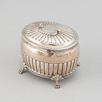 A silver creamer by Johan Petter Ahlforss, Strängnäs, 1833 and a silver sugar box, Kristianstad, 1928.