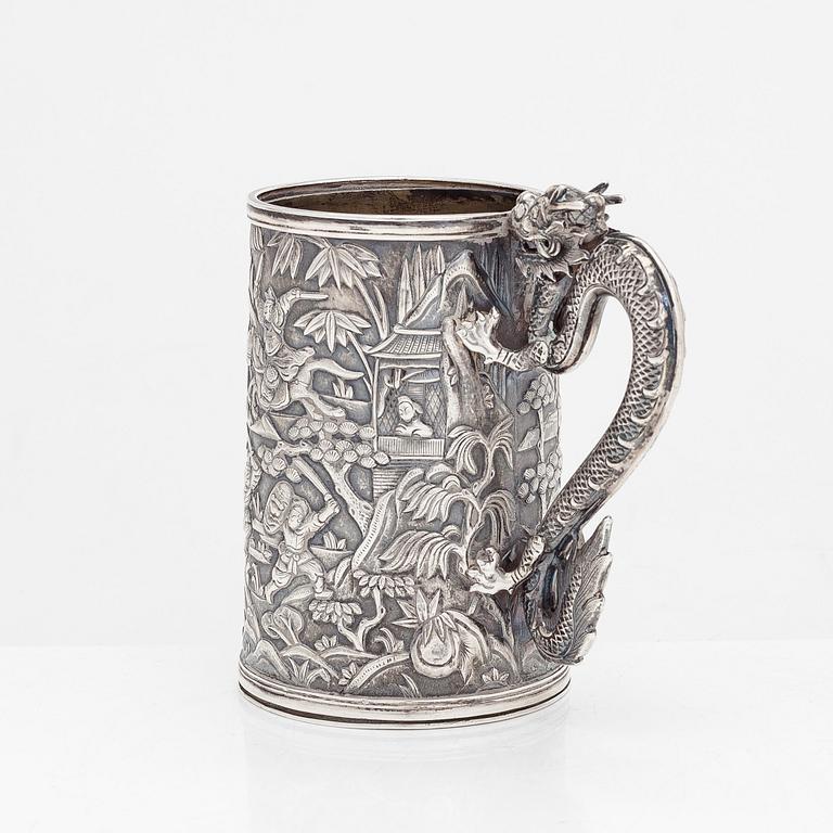 A Chinese export silver battle scene mug, retailer Leeching, latter half of the 19th century.