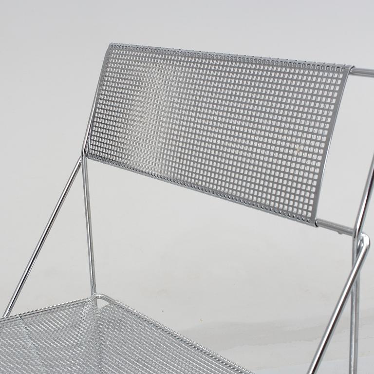 8 contemporary stackable metal chairs.