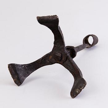 A CANDLESTICK, iron, 18th century or older.