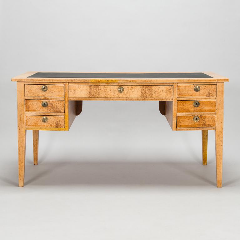 A late 19th-century curly birch veneered writing desk.