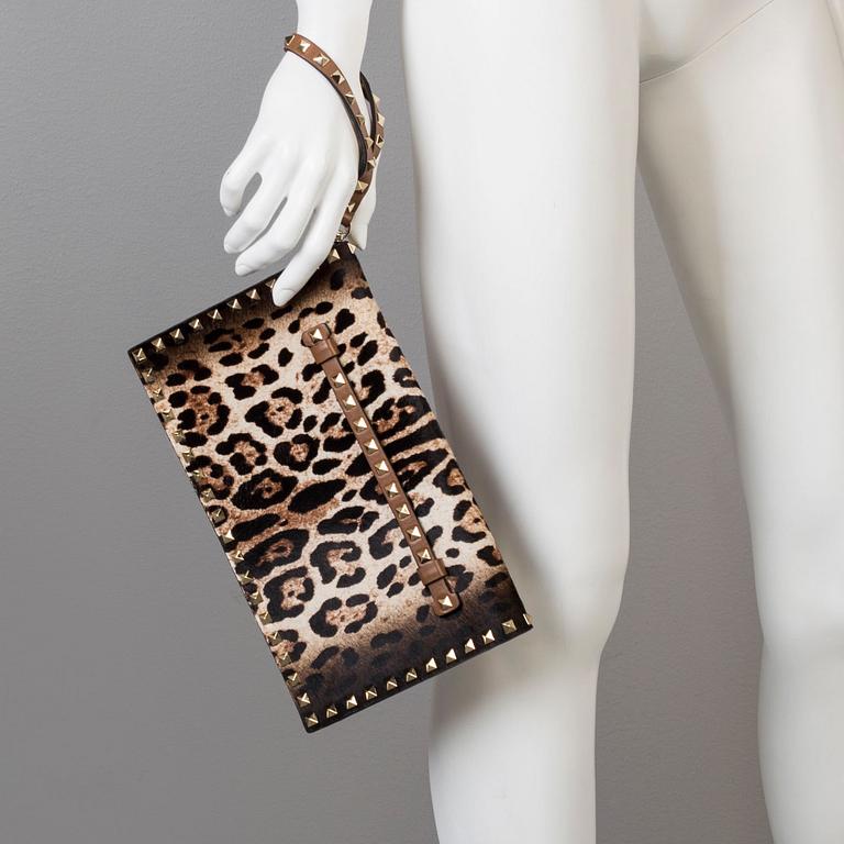 A ponyhair clutch with studs by Valentino.