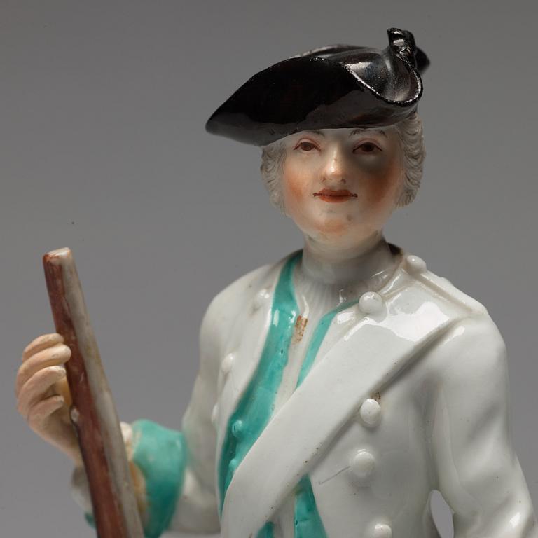 A German unmarked porcelain figure of a huntsman, 18/19th Century.