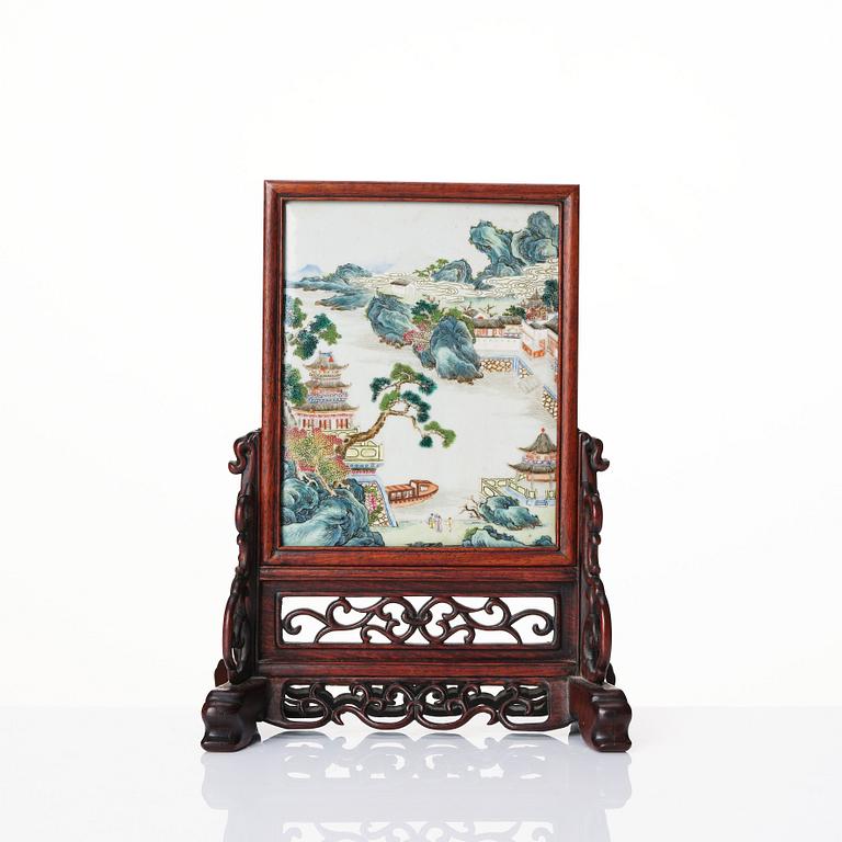 A famille rose table screen in a wooden stand, Qing dynasty, 19th Century.