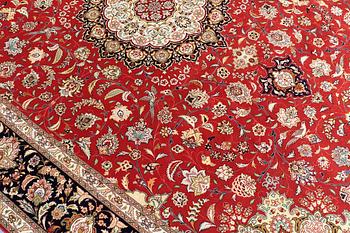 A carpet, Täbriz part silk, 341 x 248 cm.