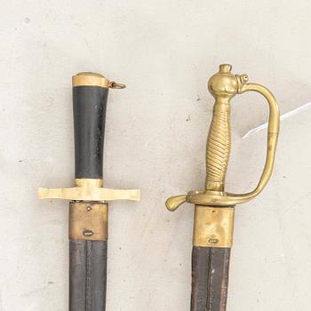 Two Swedish cutlasses 1856 pattern withs scabbards.