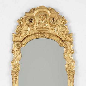 A North European late baroque giltwood mirror, first part of the 18th century.