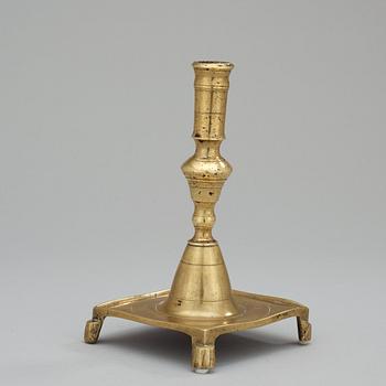 A Baroque 17/18th century brass candlestick.