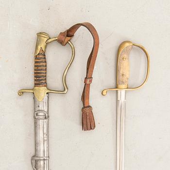 A Swedish sabre 1899 pattern with scabbard with another sword.
