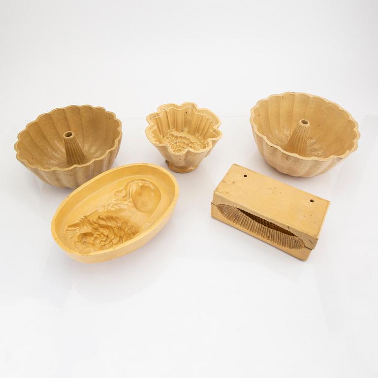 A set of five glazed earthenware moulds from Höganäs around 1900.