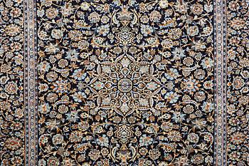 A Kashan carpet, signed, c. 381 x 285 cm.