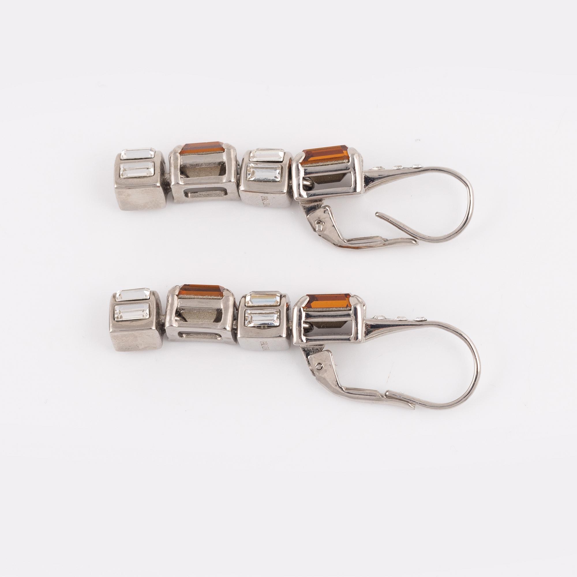 Prada, a pair of rhinestone and strass earrings.